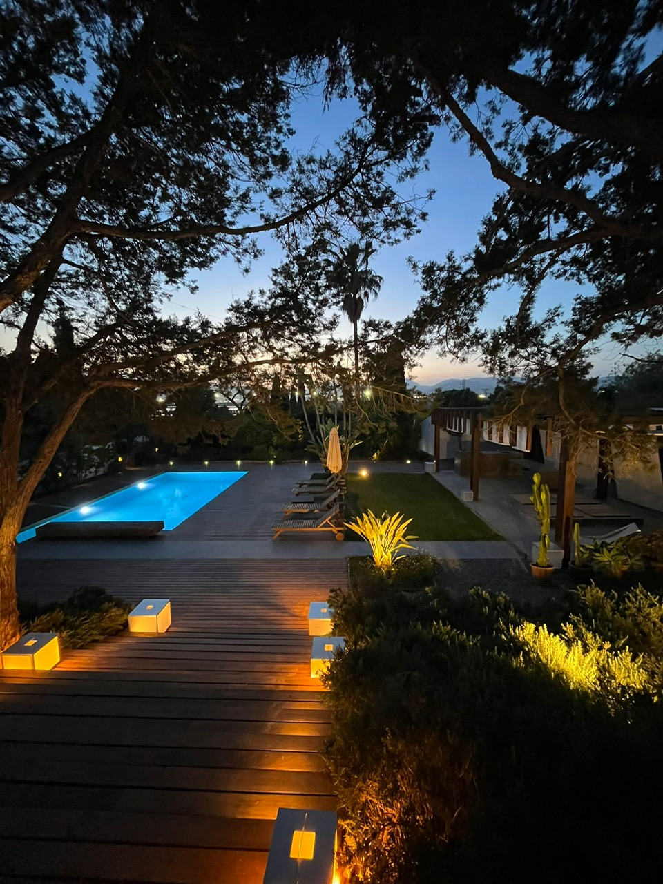 Pool and gardens at dusk